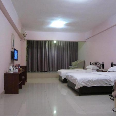 Taohuayuan Apartment Hotel Нанинг Екстериор снимка