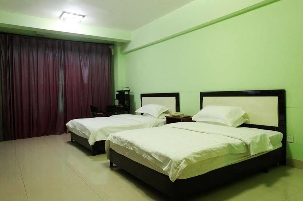 Taohuayuan Apartment Hotel Нанинг Екстериор снимка